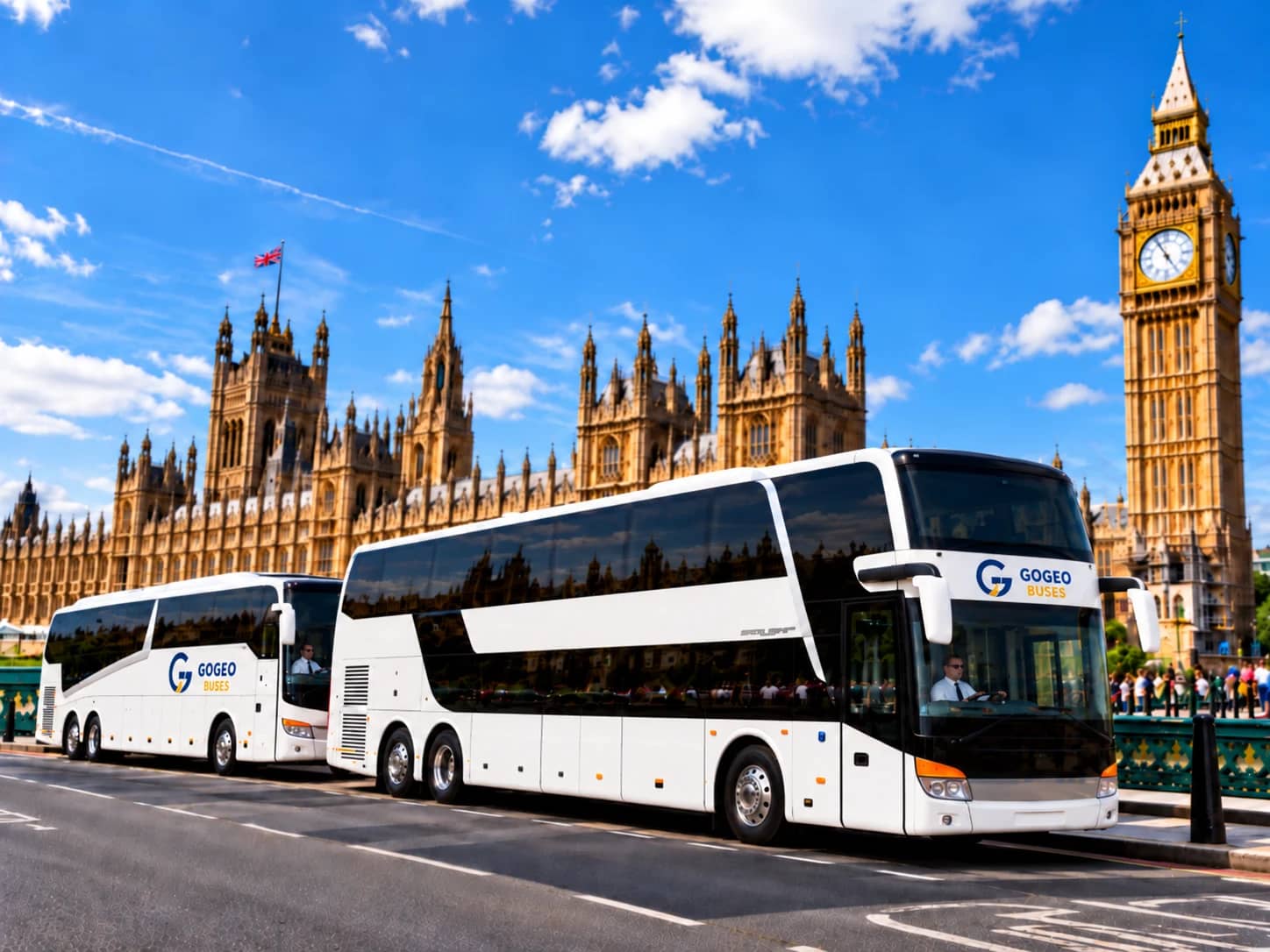 Two GoGeo Buses coaches beside the Palace of Westminster in London